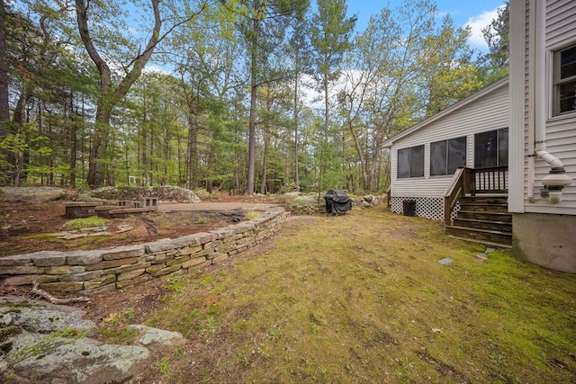 view of yard with a sunroom