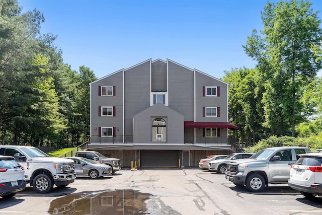 multi unit property featuring uncovered parking