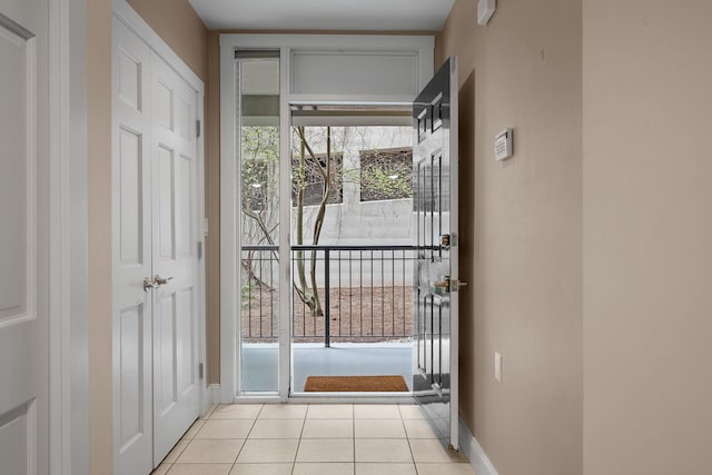 40 College St Unit 210, Burlington, VT 05401 - doorway to outside with light tile patterned floors and baseboards