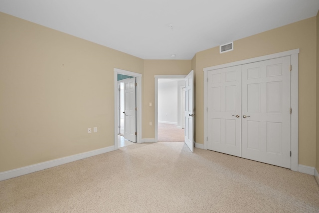 40 College St Unit 210, Burlington, VT 05401 - unfurnished bedroom with light colored carpet, a closet, and baseboards