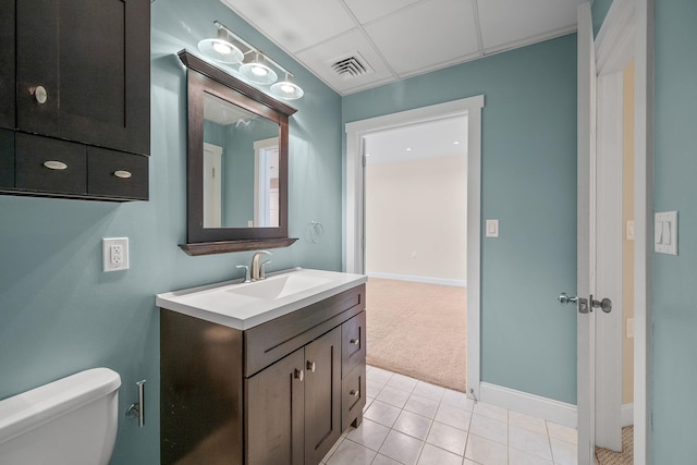 40 College St Unit 210, Burlington, VT 05401 - bathroom featuring vanity, toilet, tile patterned floors, and baseboards