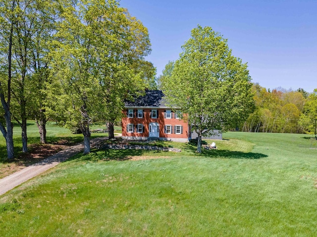 back of property with a yard