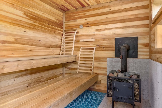 relaxing sauna / steam room featuring wooden walls and wood ceiling