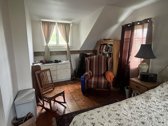 bedroom with wood-type flooring and lofted ceiling