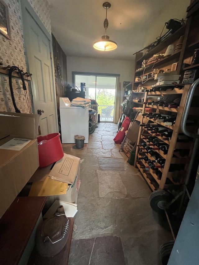 interior space featuring stone tile flooring and washing machine and dryer