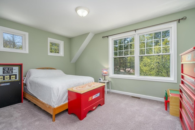 carpeted bedroom featuring baseboards