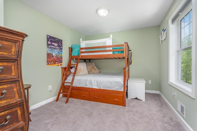 carpeted bedroom with baseboards