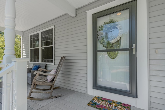 doorway to property featuring a porch