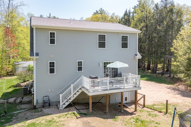 back of property featuring a wooden deck, central air condition unit, and stairs