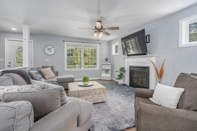 living area with plenty of natural light, ceiling fan, a fireplace, wood finished floors, and recessed lighting