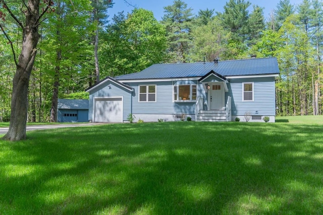 5 Wentworth Dr, Newton, NH 03858 - ranch-style home featuring a front lawn, a garage, and metal roof