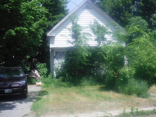 view of side of property with driveway