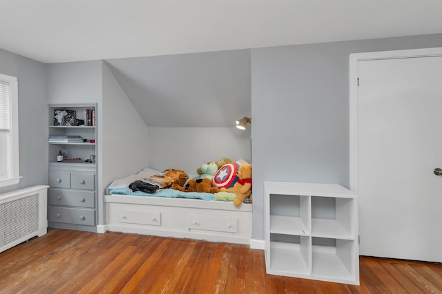 74 Pine St, Rollinsford, NH 03869 - bedroom with radiator heating unit and wood finished floors