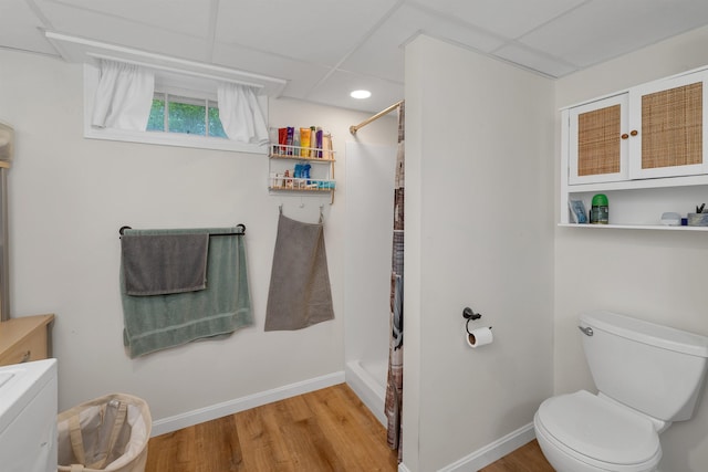 74 Pine St, Rollinsford, NH 03869 - bathroom with toilet, wood finished floors, a shower with curtain, and baseboards
