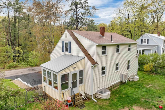74 Pine St, Rollinsford, NH 03869 - rear view of property with a chimney, entry steps, a sunroom, and a shingled roof