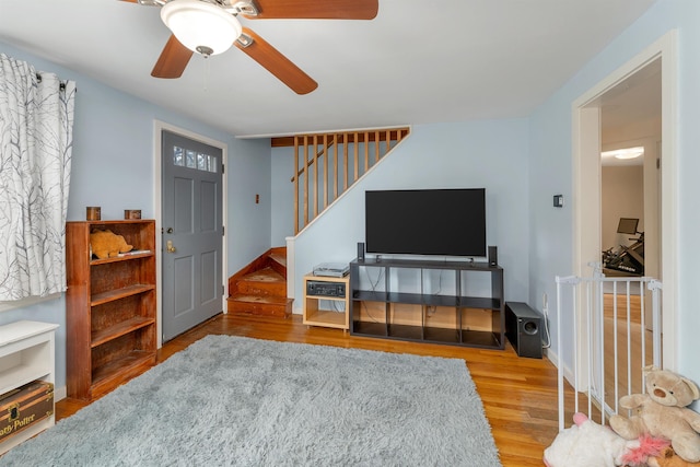 74 Pine St, Rollinsford, NH 03869 - living area with wood finished floors, stairway, a ceiling fan, and baseboards
