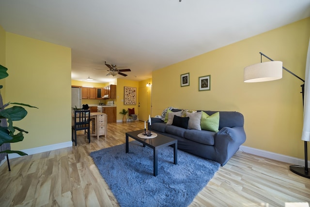 470 Silver St Unit 223, Manchester, NH 03103 - living room with light wood-style floors, baseboards, and ceiling fan