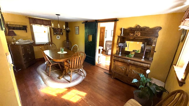 171 Stoneham Rd, Wakefield, NH 03872 - dining space featuring a barn door, wood finished floors, and a chandelier