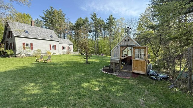 171 Stoneham Rd, Wakefield, NH 03872 - view of grassy yard featuring an outbuilding and an exterior structure