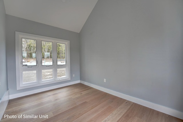 4 Fowler Dr, Rye, NH 03870 - empty room featuring baseboards, light wood-style flooring, and high vaulted ceiling