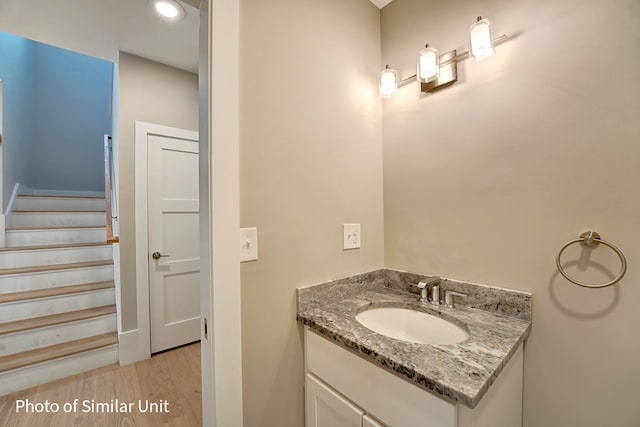 4 Fowler Dr, Rye, NH 03870 - bathroom with wood finished floors, vanity, and recessed lighting