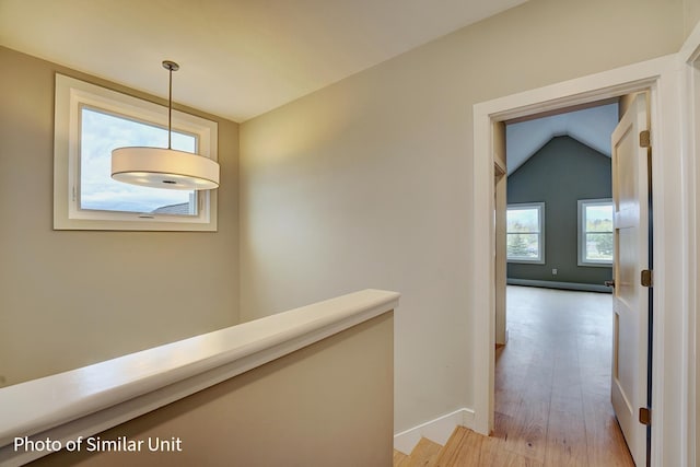 4 Fowler Dr, Rye, NH 03870 - hallway featuring light wood-style flooring, baseboards, and vaulted ceiling