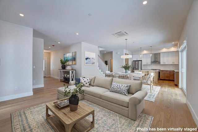 4 Fowler Dr, Rye, NH 03870 - living area with stairway, light wood-style floors, baseboards, and recessed lighting