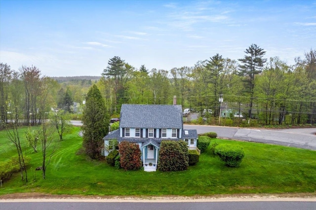 3 King Rd, Chichester, NH 03258 - view of front of house with a front lawn, a chimney, and a wooded view