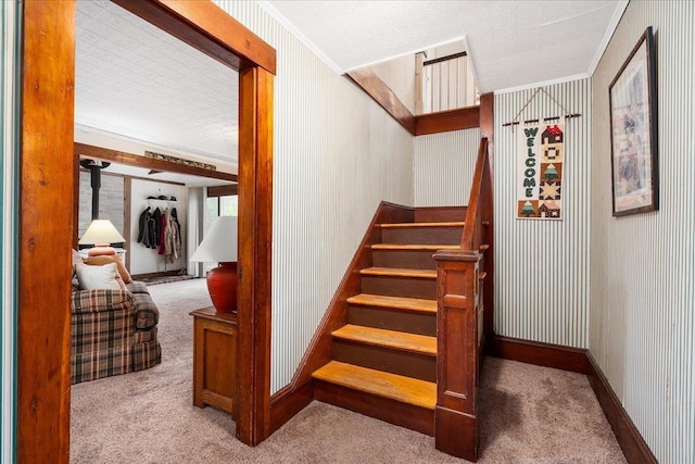 3 King Rd, Chichester, NH 03258 - staircase featuring carpet, crown molding, wallpapered walls, and baseboards