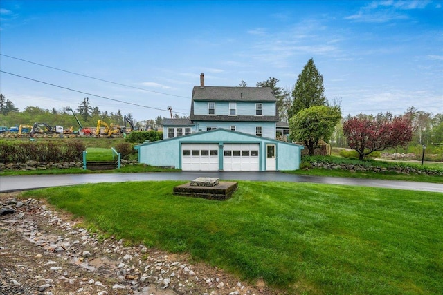 3 King Rd, Chichester, NH 03258 - view of front of house with asphalt driveway, a front lawn, and a chimney