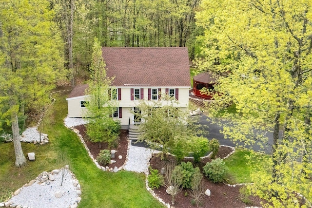 view of subject property featuring a forest