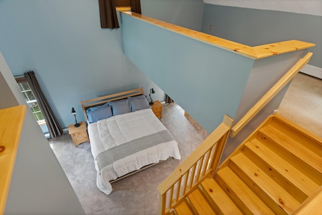 carpeted bedroom with baseboards