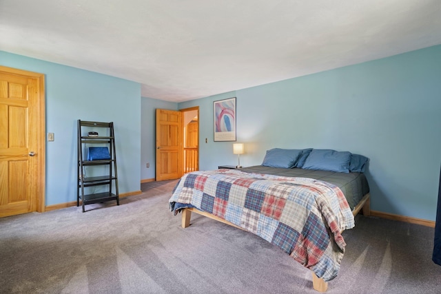 carpeted bedroom with baseboards