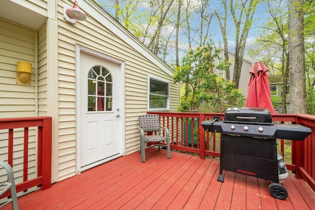 wooden terrace featuring area for grilling