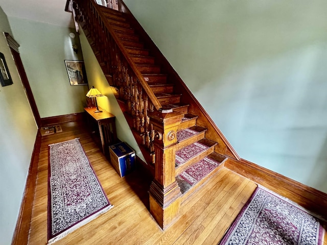 98 Pennacook St, Manchester, NH 03102 - stairway featuring wood finished floors and baseboards