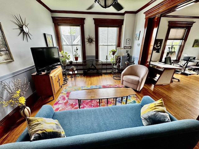 98 Pennacook St, Manchester, NH 03102 - living area with wood finished floors, ornamental molding, and a wainscoted wall