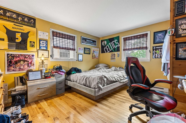 17 Dyson Dr, Salem, NH 03079 - bedroom with wood finished floors, cooling unit, and an office area