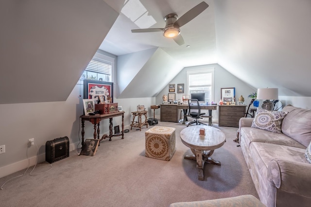 carpeted living room with a desk, lofted ceiling, ceiling fan, and baseboards