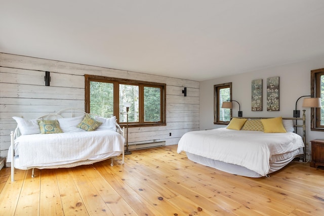 67 Birch Tree Ln, Fayston, VT 05673 - bedroom with baseboard heating, wooden walls, and wood-type flooring