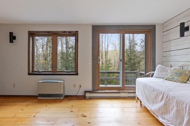 67 Birch Tree Ln, Fayston, VT 05673 - bedroom featuring a baseboard radiator, multiple windows, light wood finished floors, and baseboards