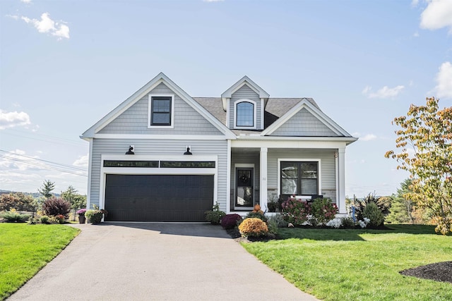 20 Del Ray Dr, Windham, NH 03087 - view of front of property with a front lawn, concrete driveway, a garage, and a porch