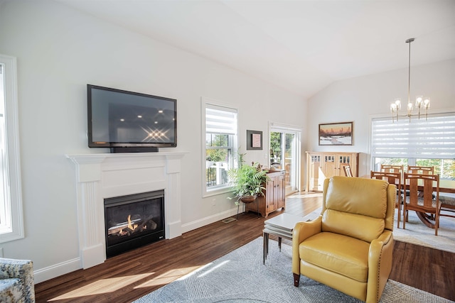 20 Del Ray Dr, Windham, NH 03087 - sitting room with a chandelier, wood finished floors, vaulted ceiling, a glass covered fireplace, and baseboards
