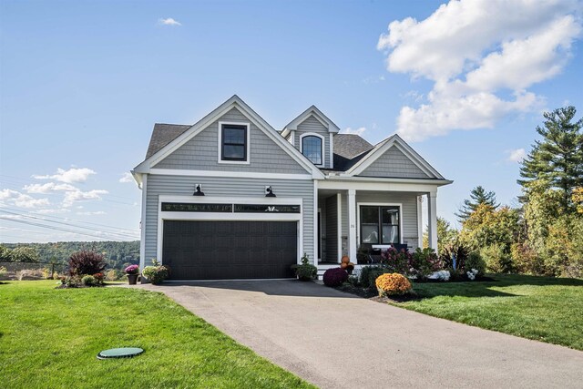 20 Del Ray Dr, Windham, NH 03087 - view of front of home with a front yard, a porch, driveway, and an attached garage