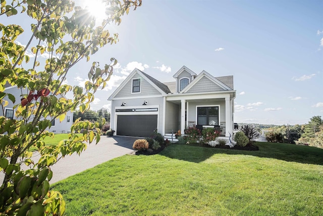 20 Del Ray Dr, Windham, NH 03087 - view of front of property featuring driveway, an attached garage, a front lawn, and covered porch