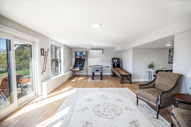 20 Del Ray Dr, Windham, NH 03087 - living area with a wall mounted air conditioner, light wood finished floors, baseboards, and recessed lighting