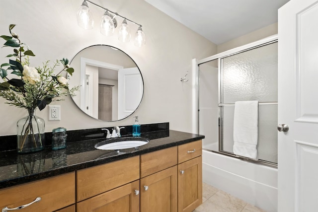 full bathroom featuring vanity, bath / shower combo with glass door, and tile patterned floors