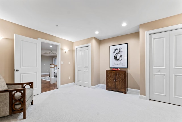 carpeted bedroom featuring baseboards and recessed lighting