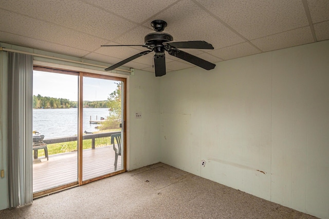 59 Lake Rd, Wakefield, NH 03872 - empty room featuring a ceiling fan, a water view, and a drop ceiling