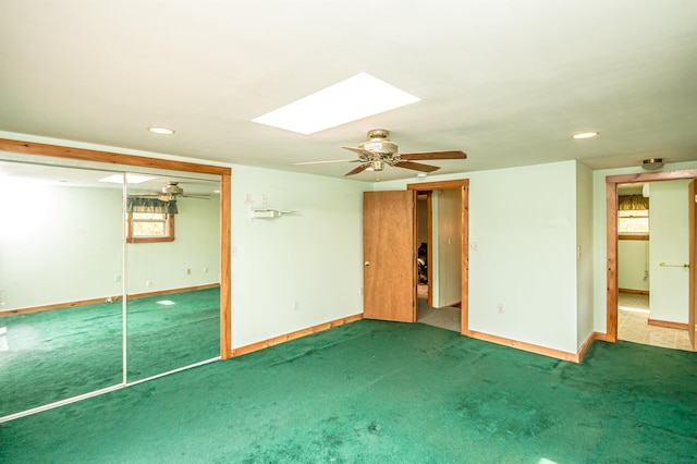 59 Lake Rd, Wakefield, NH 03872 - unfurnished bedroom featuring baseboards, carpet floors, a skylight, a ceiling fan, and recessed lighting