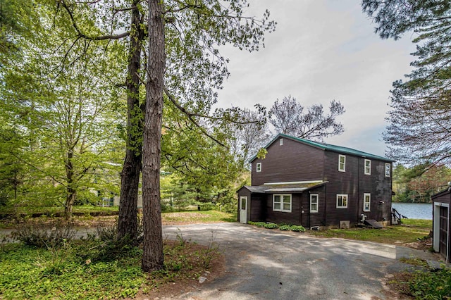 59 Lake Rd, Wakefield, NH 03872 - view of side of property featuring asphalt driveway